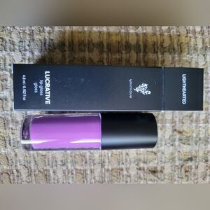 Younique lip gloss shade lighthearted